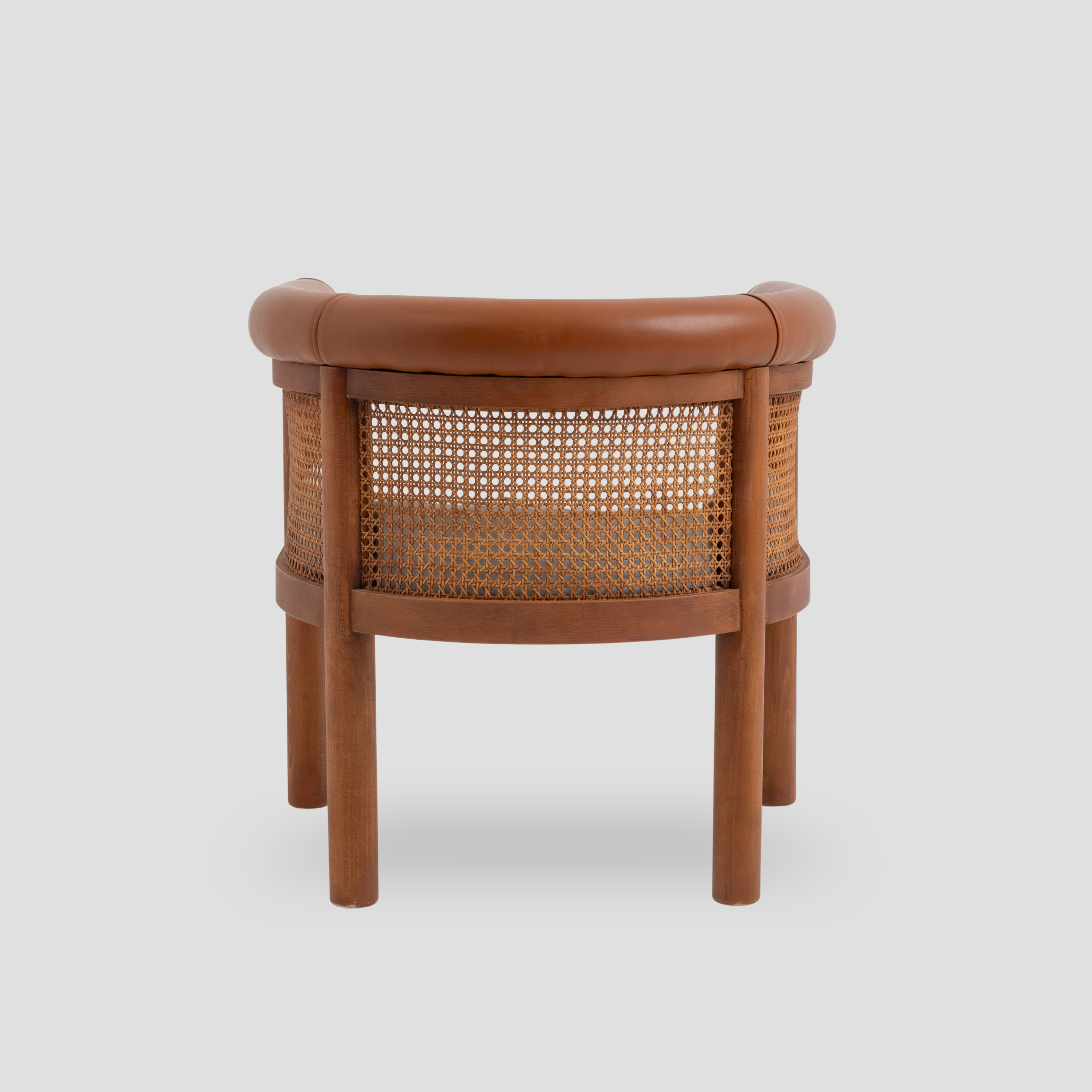Amber Cane Barrel Armchair in cane back and beech wood, featuring mid century modern styling.