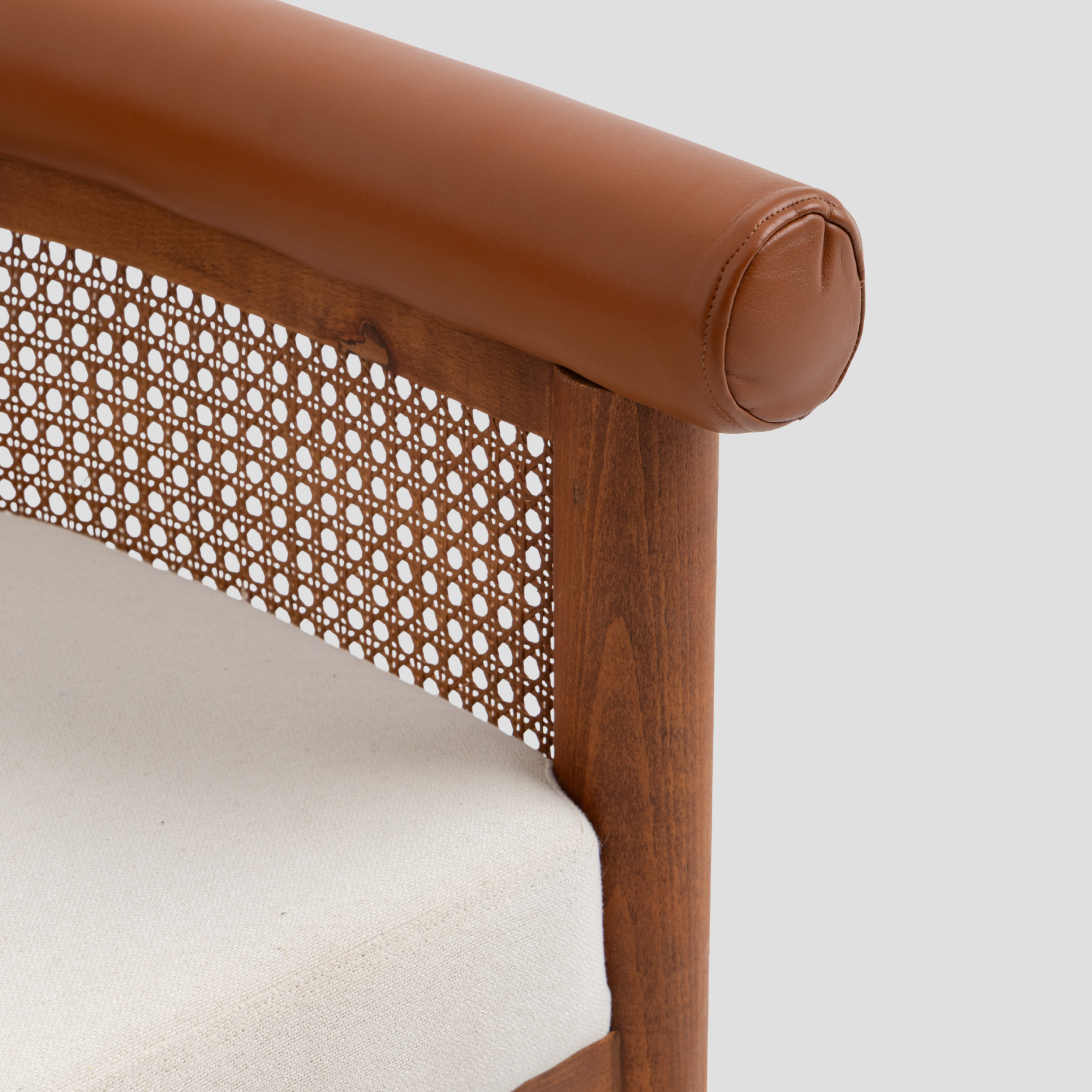 Amber Cane Barrel Armchair in cane back and beech wood, featuring mid century modern styling.
