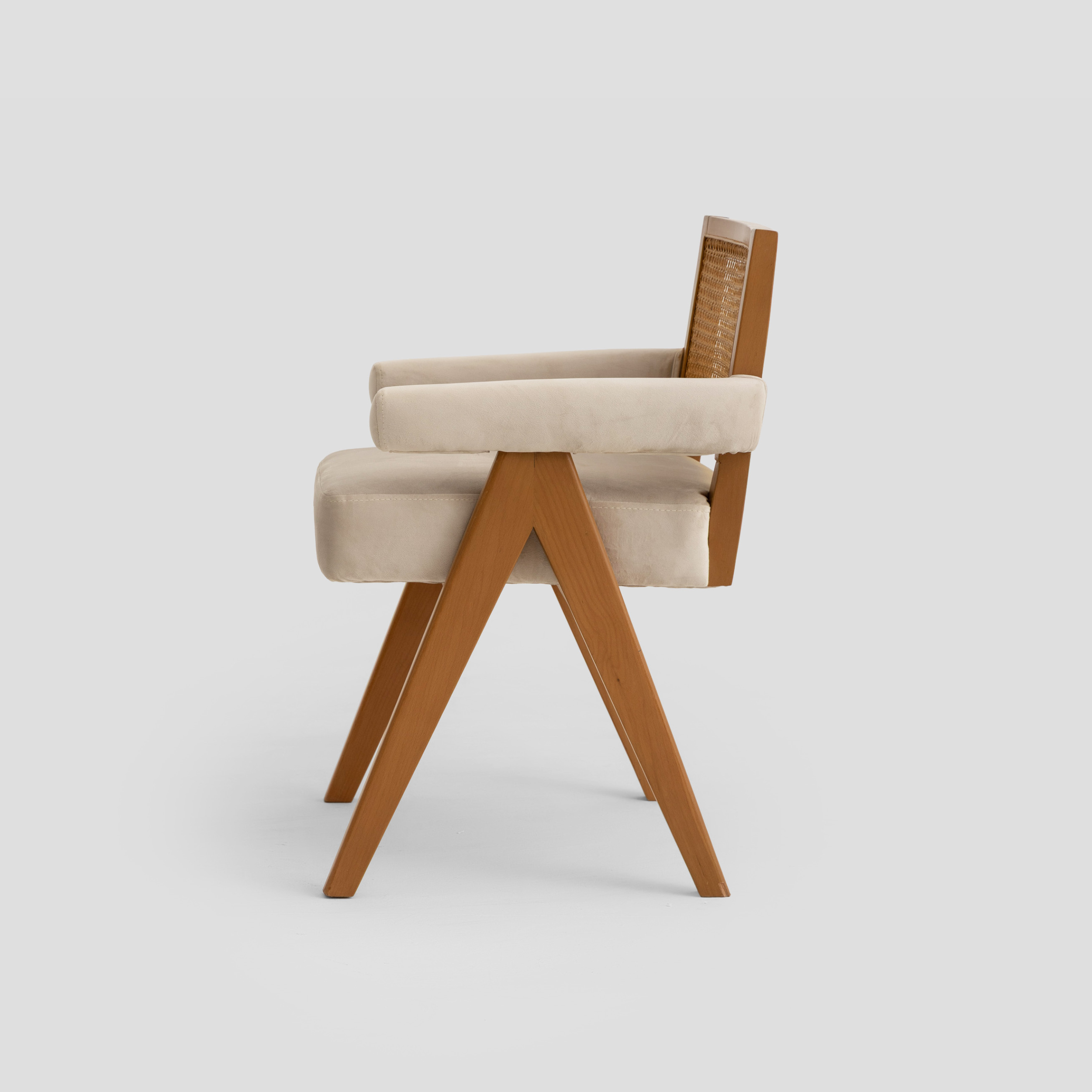 Elaf Caned Armchair in cane back, beech wood, and padded seat, featuring mid century styling.