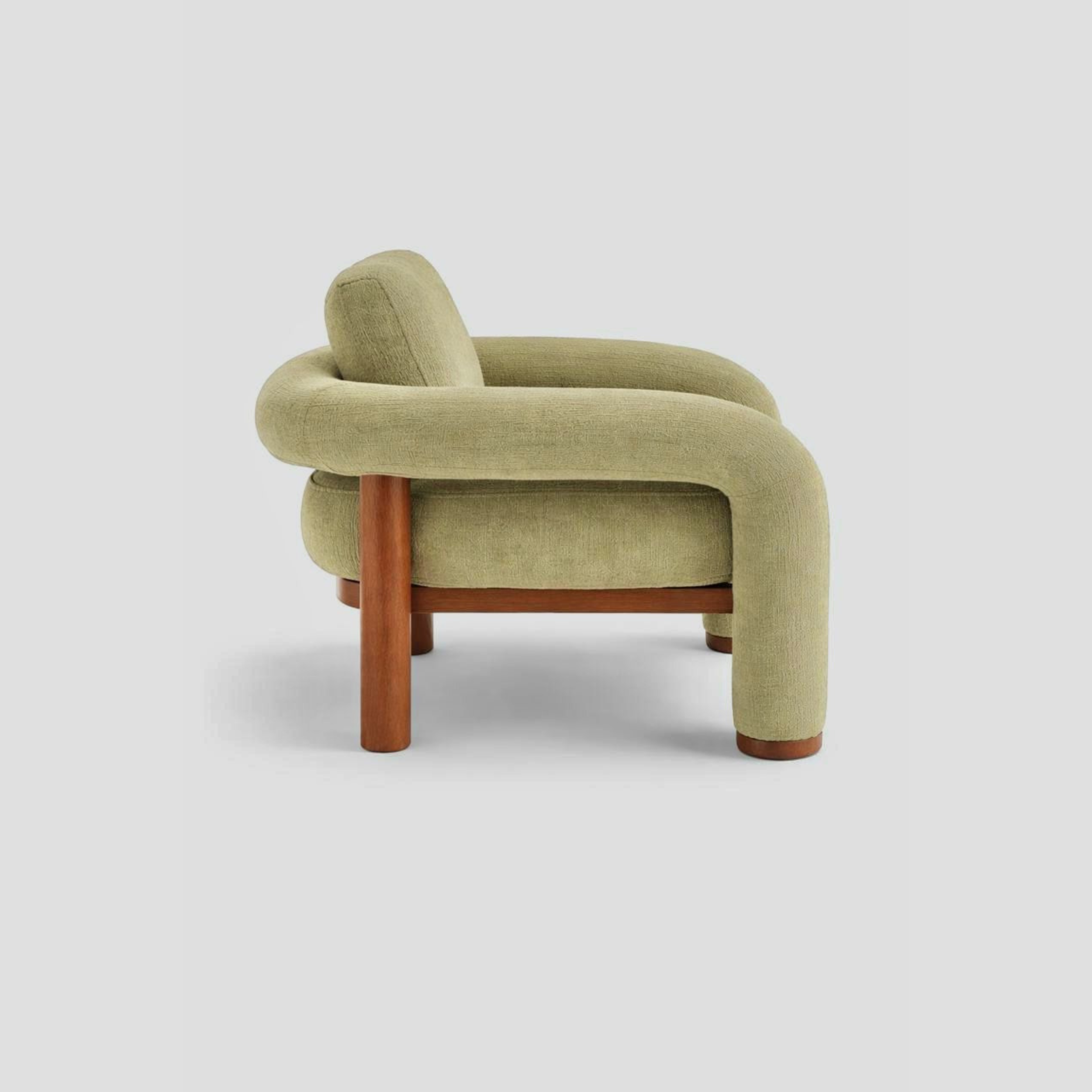 Matcha Armchair in beech frame, featuring mid century modern styling, with reading.