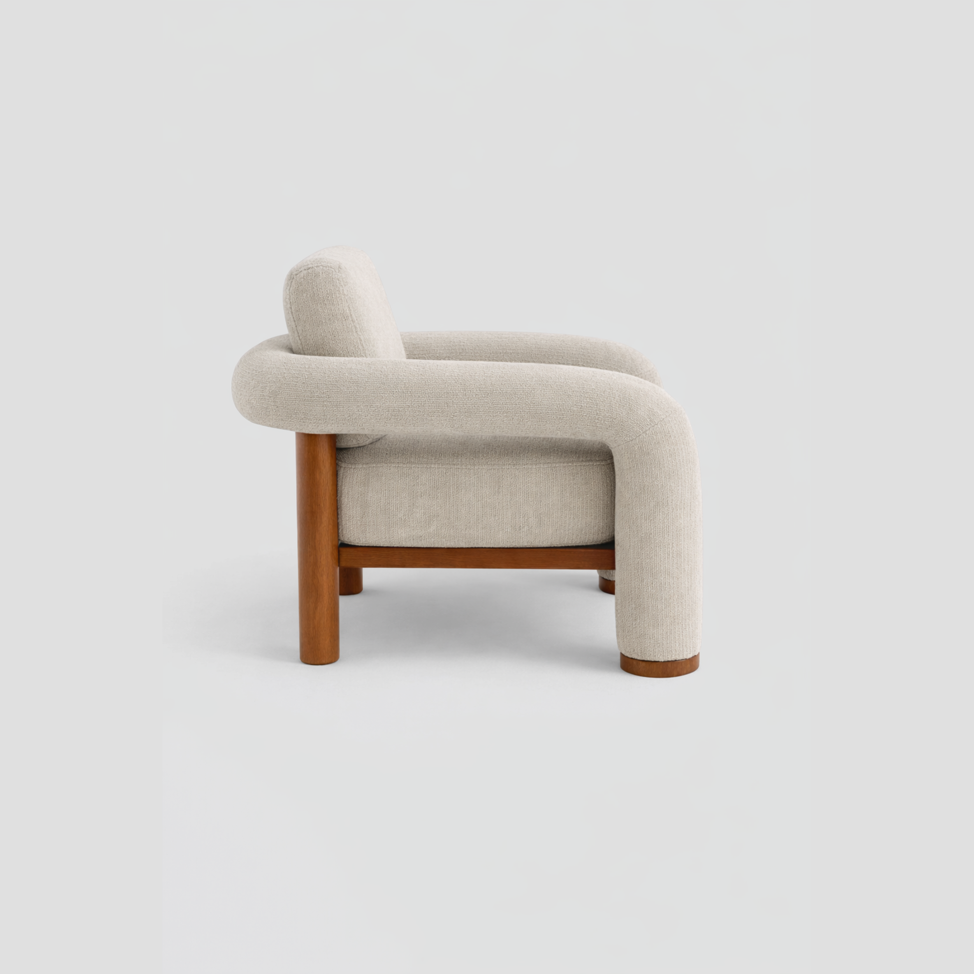 Matcha Armchair in beech frame, featuring mid century modern styling, with reading.