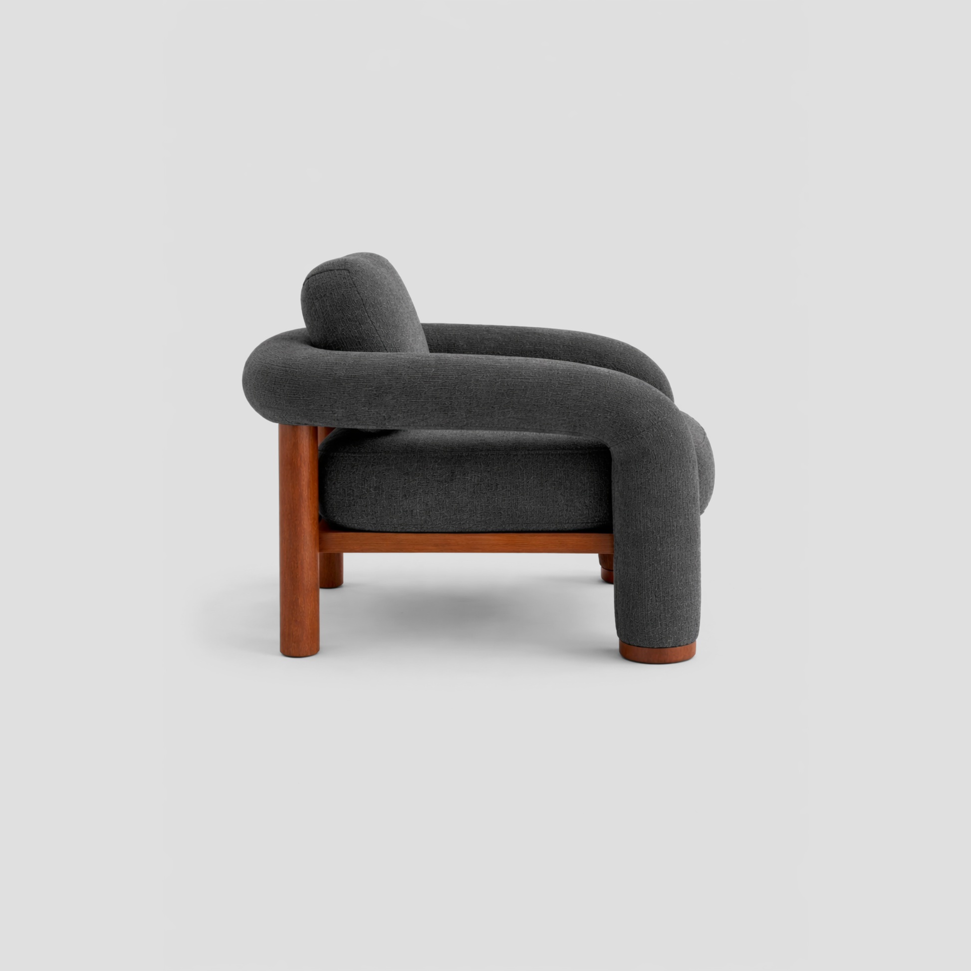 Matcha Armchair in beech frame, featuring mid century modern styling, with reading.