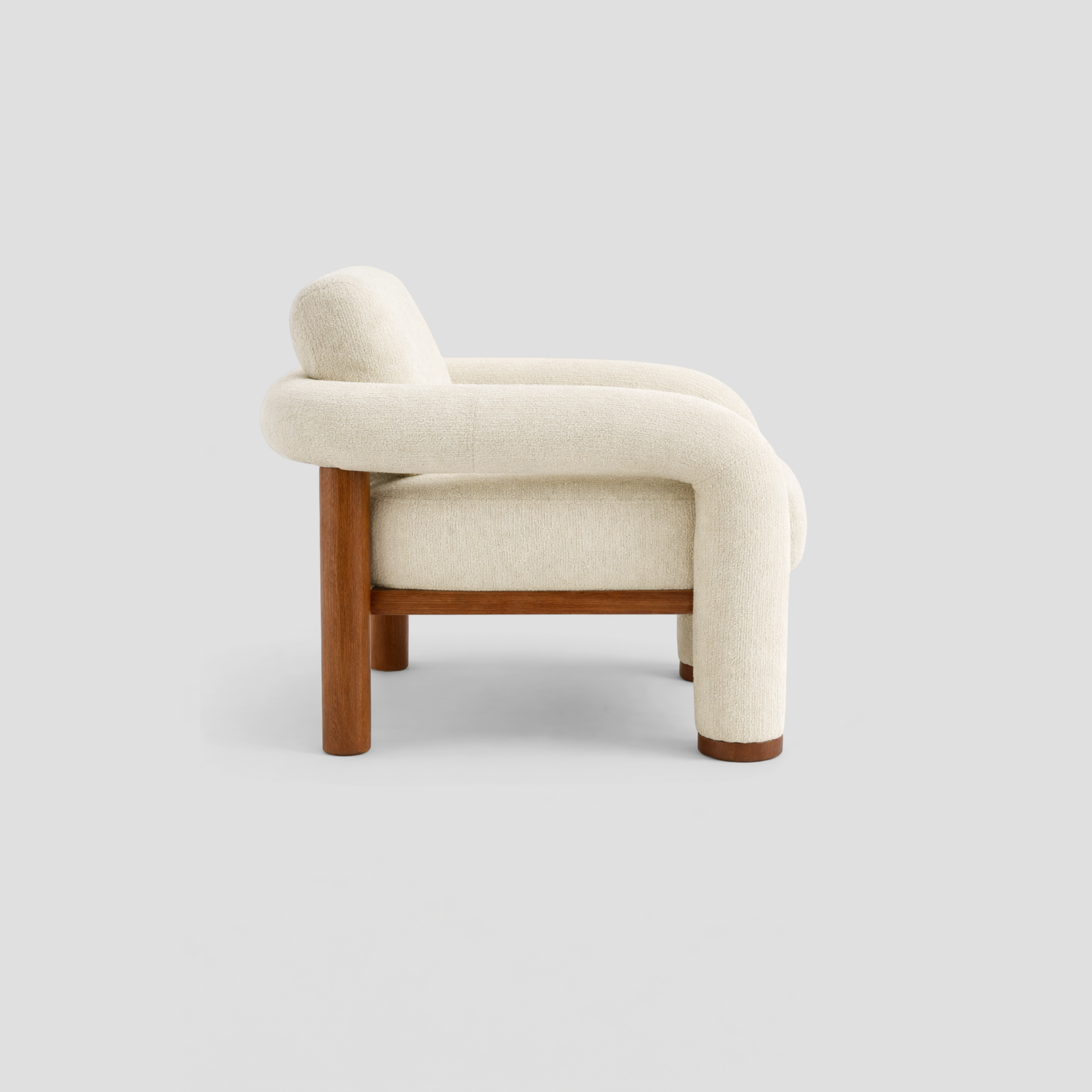Matcha Armchair in beech frame, featuring mid century modern styling, with reading.
