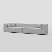 Modern linear three seater floor sitting modular sofa with a tuxedo arm beech frame.