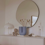 Willie Oval Wall Mirror, featuring modern minimal styling, perfect for entryways, with black frame.