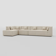 Large floor sitting L shape modular sofa with a pillow back beech frame design.
