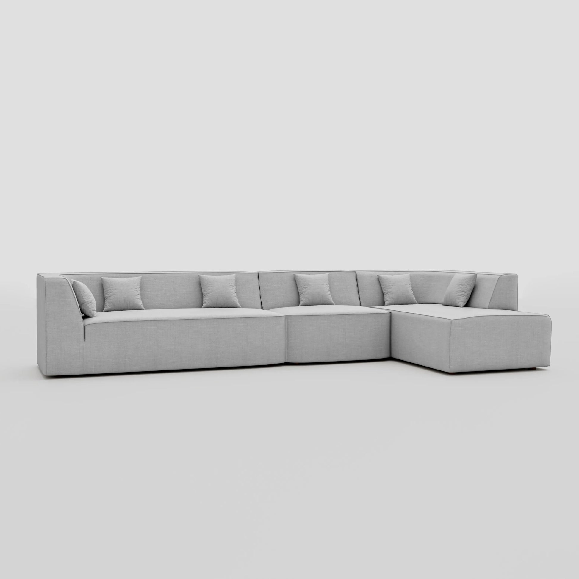 Large floor sitting L shape modular sofa with a pillow back beech frame design.